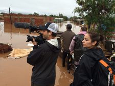 Brad Allgood filming the flooding of Cateura with Juliana Peñaranda-Loftus